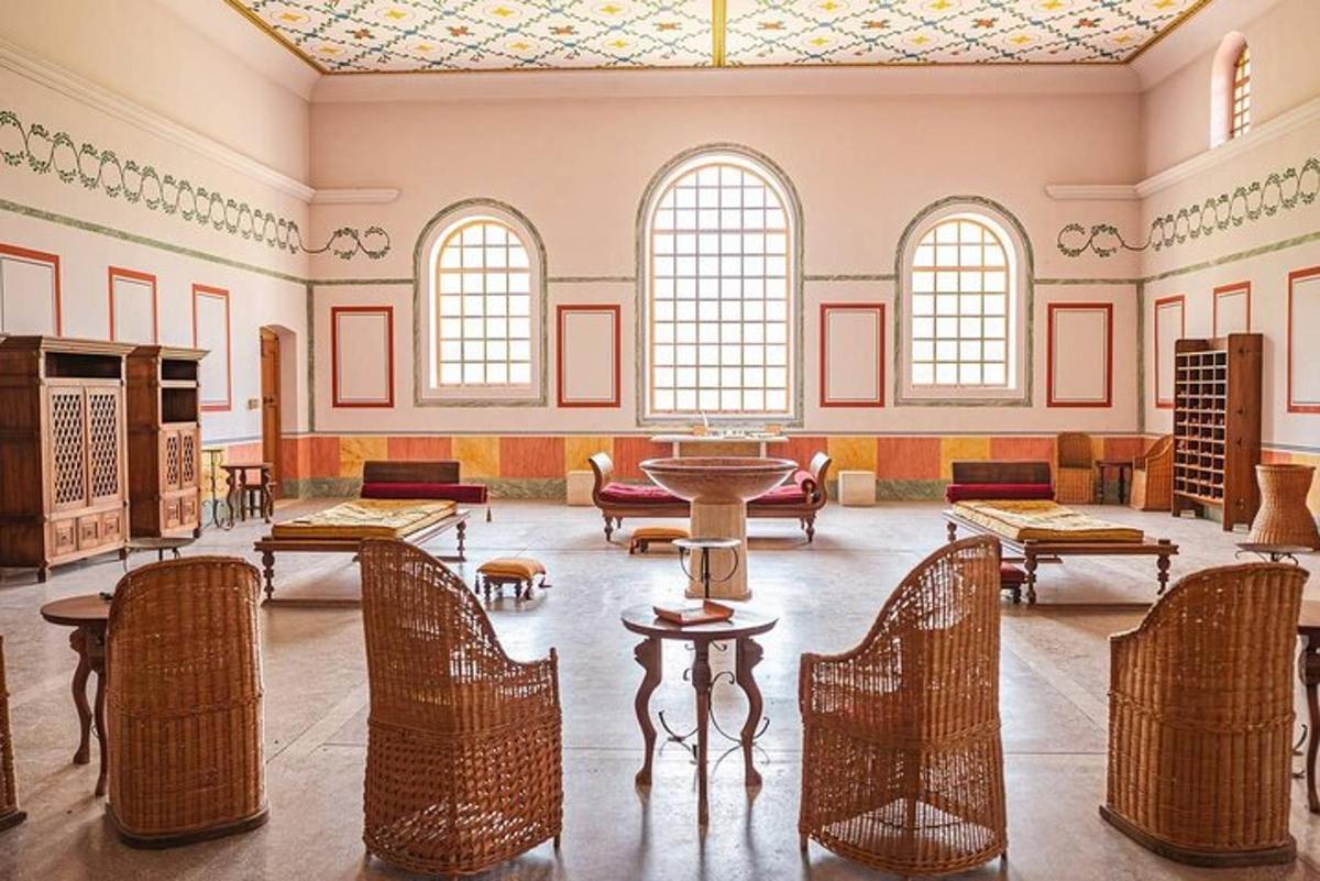 a large room with chairs and tables and windows