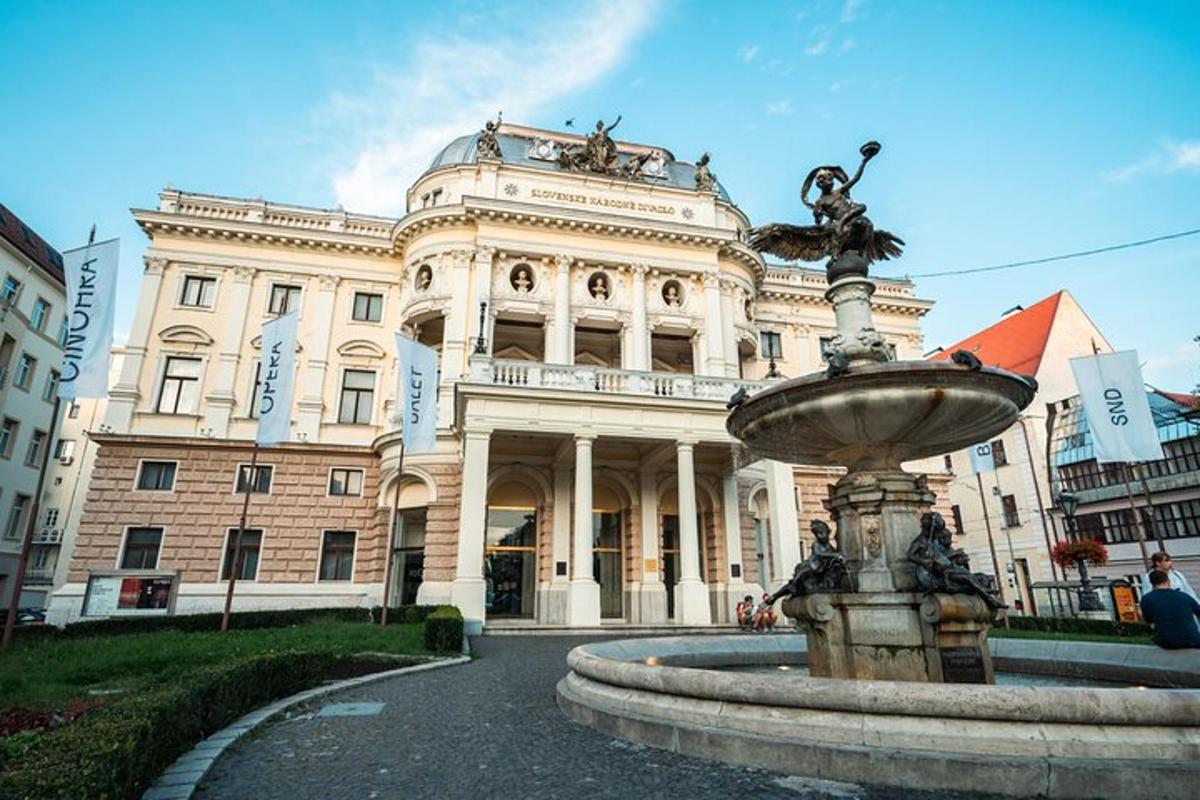 a building with a fountain in front of a building