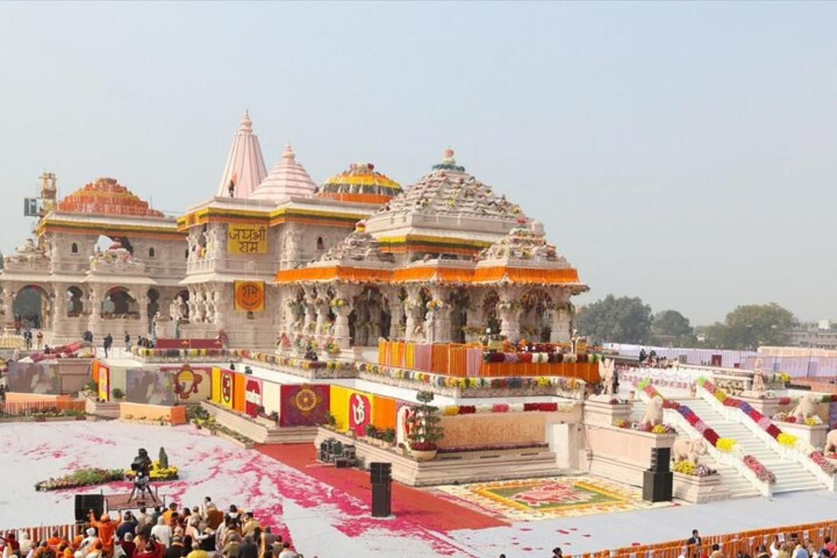 a large building with a crowd of people standing around it
