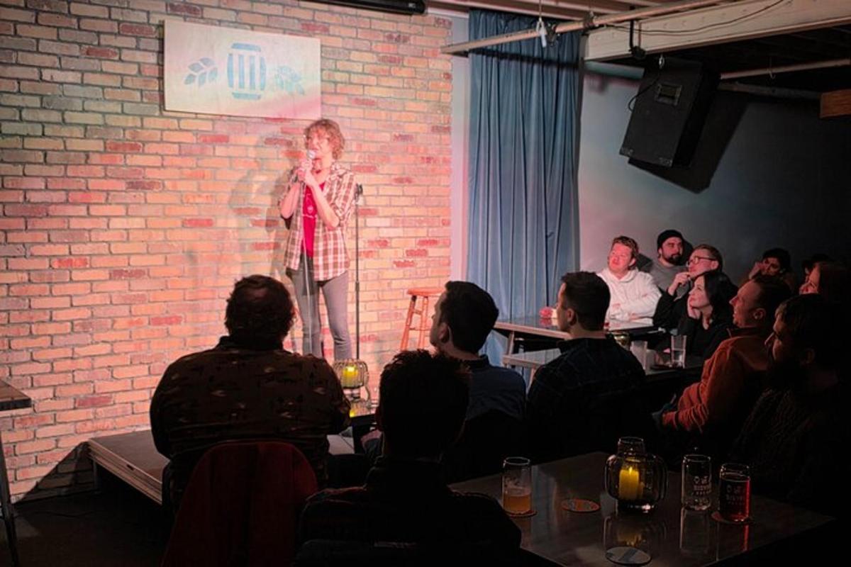 a woman standing on a stage in front of a crowd