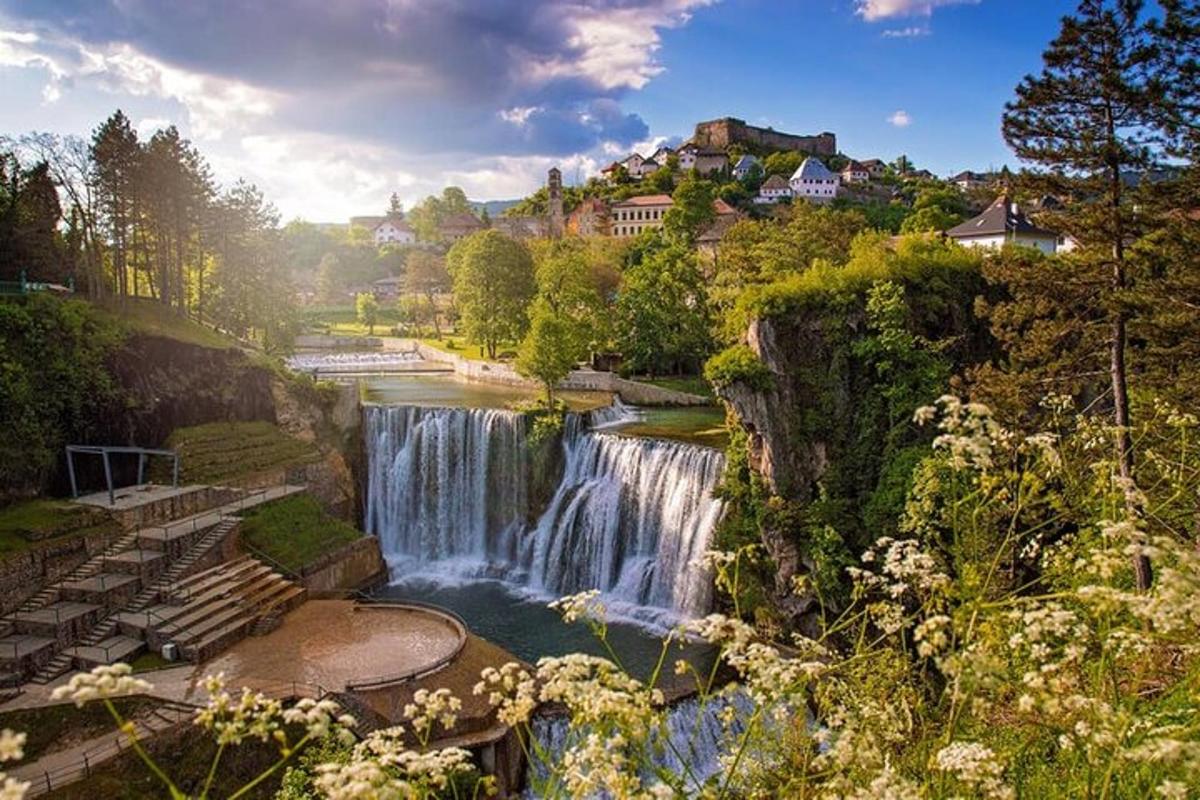 a waterfall in the middle of a river
