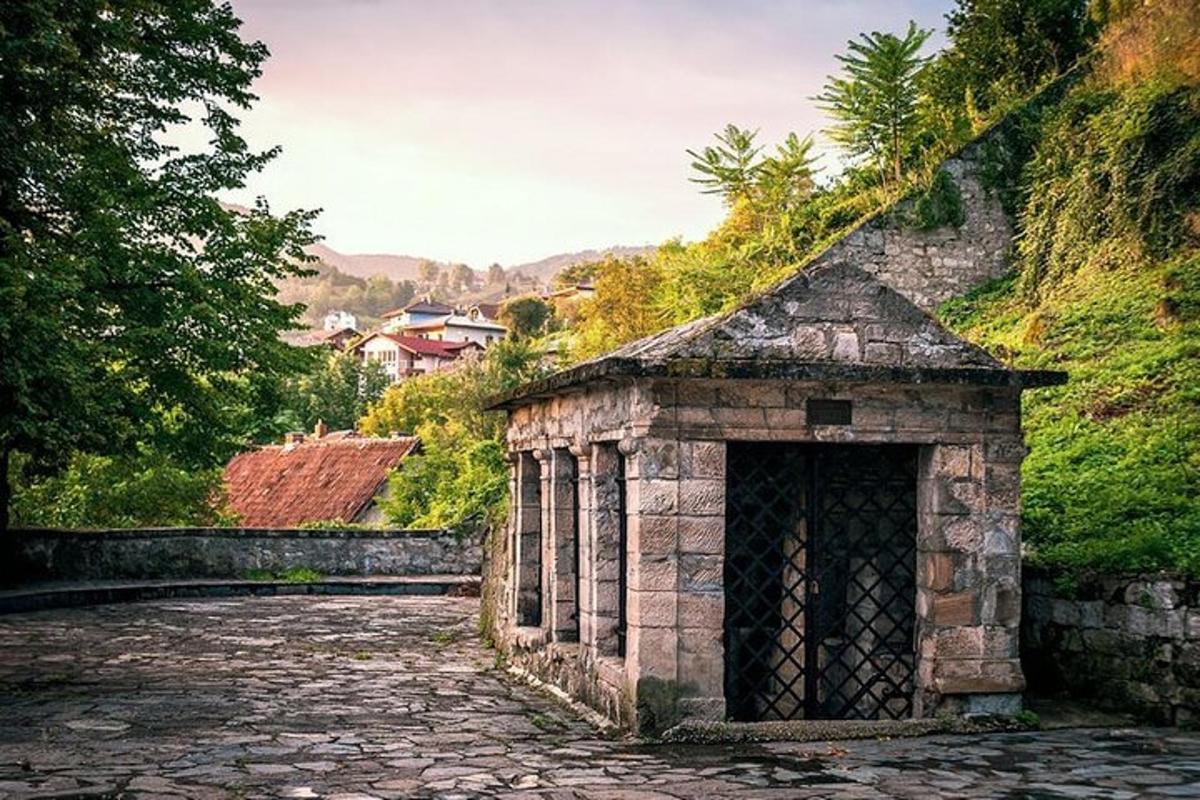 an old stone building on a stone road