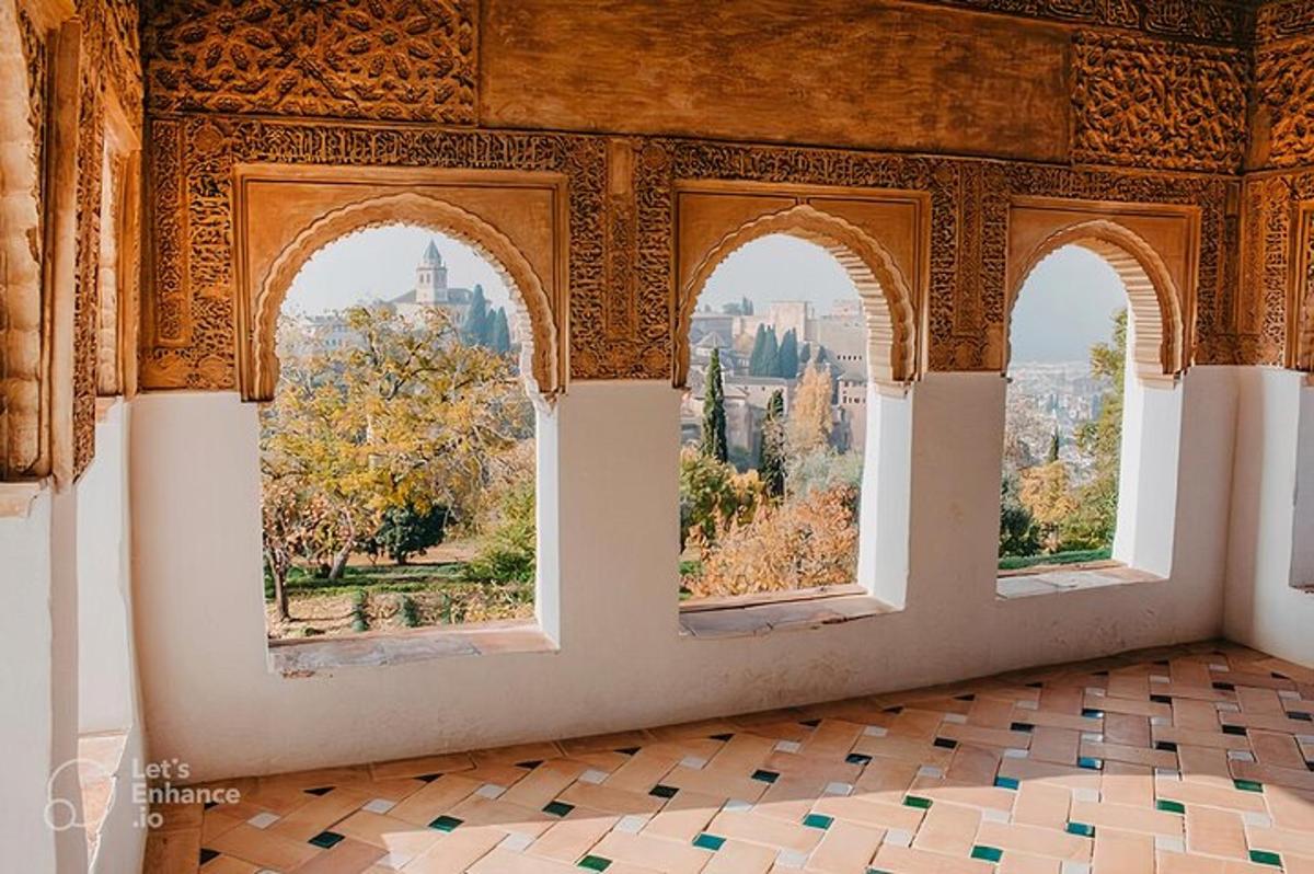 a room with three windows and a view of the city