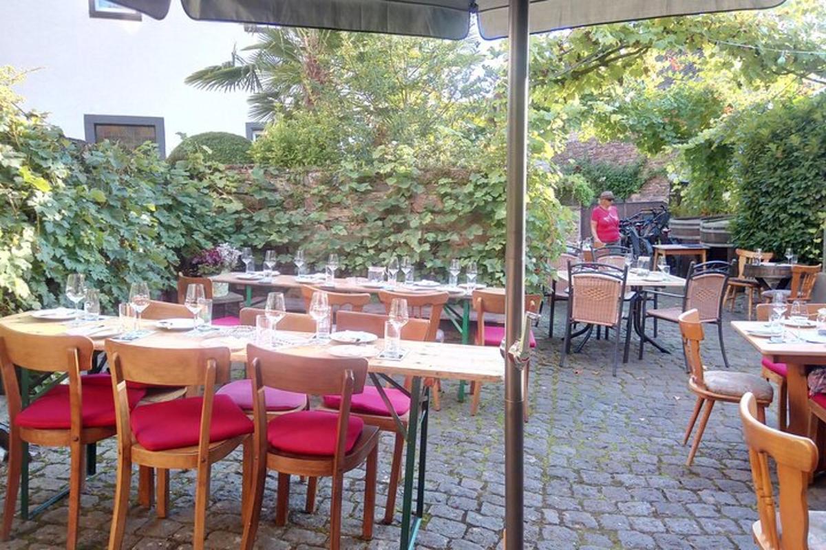 a tables and chairs with wine glasses on a patio