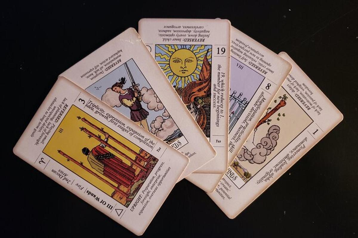 a bunch of tarot cards sitting on a table