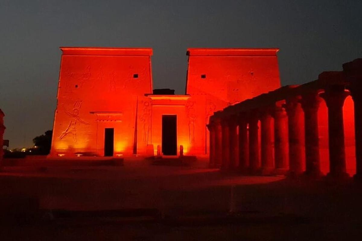 a building is lit up in red lights