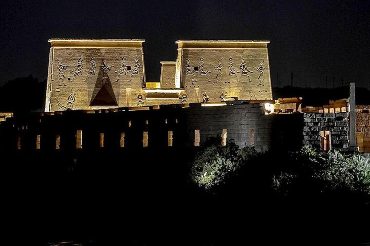 a building with writing on the side of it at night
