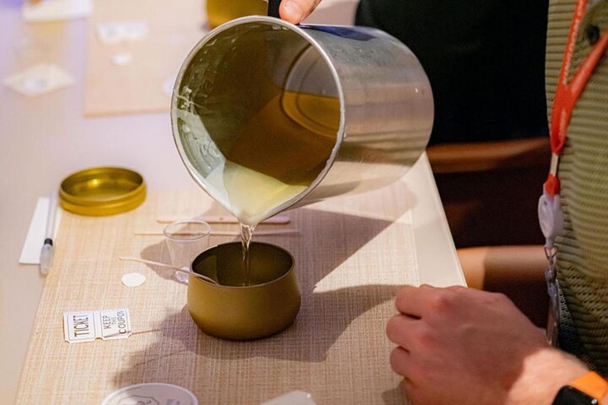 a person is pouring liquid into a mixing bowl
