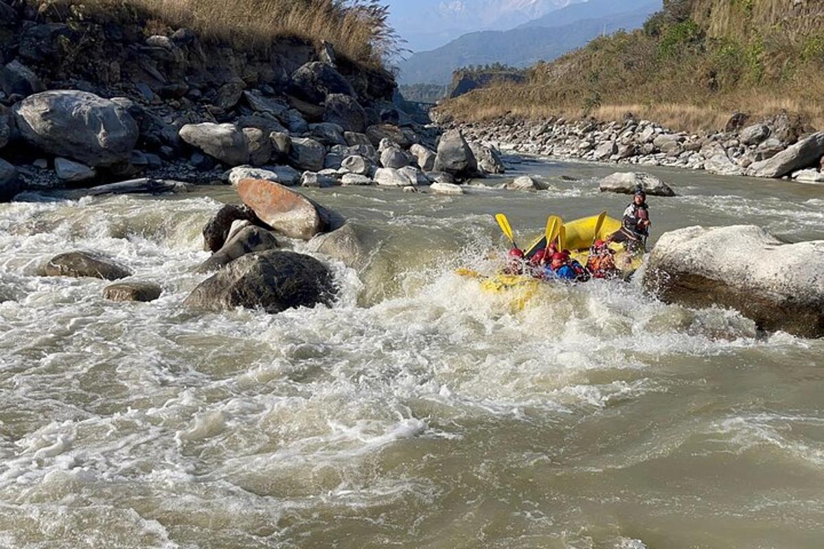 a group of people in a raft in a river