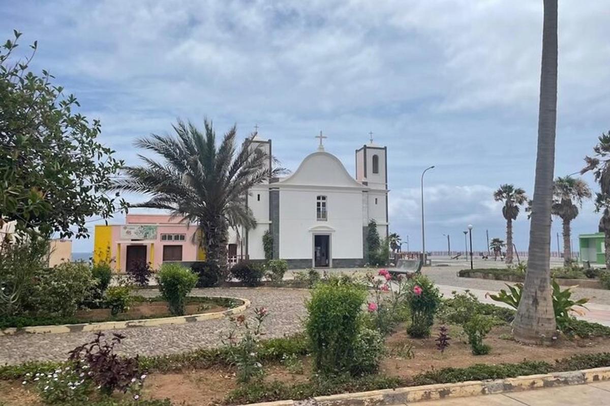 a white church with a cross on top of it
