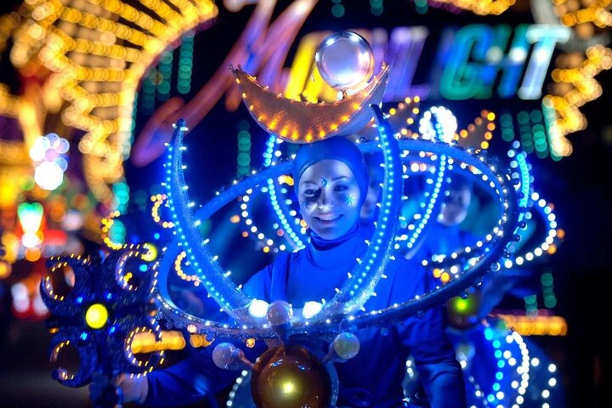 a statue of a person in a parade with lights
