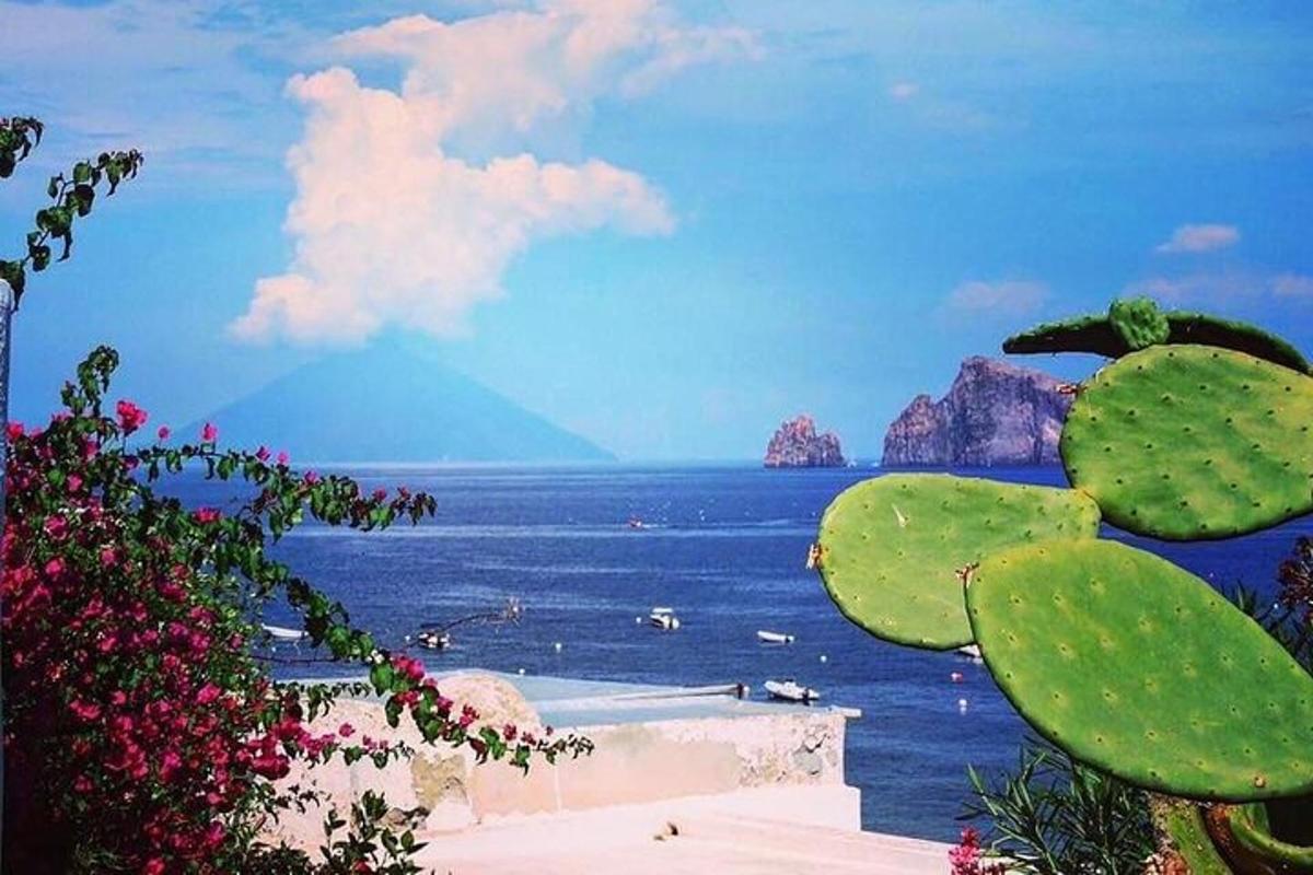 a view of the ocean with mountains in the background
