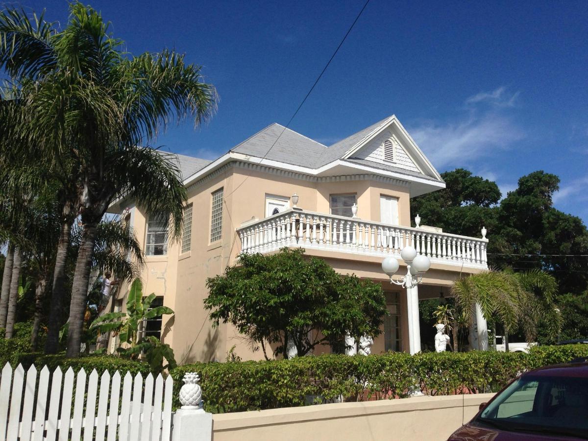 a house with a white fence in front of it