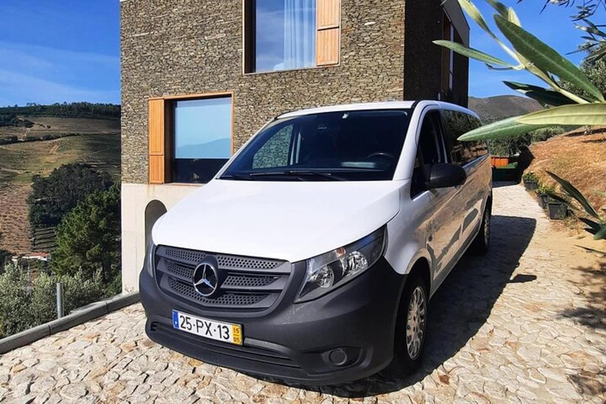 a white van parked in front of a house