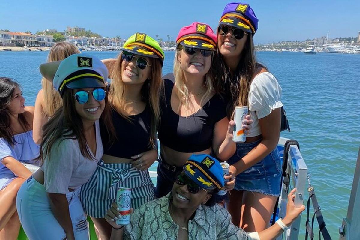 a group of women wearing hats on a boat