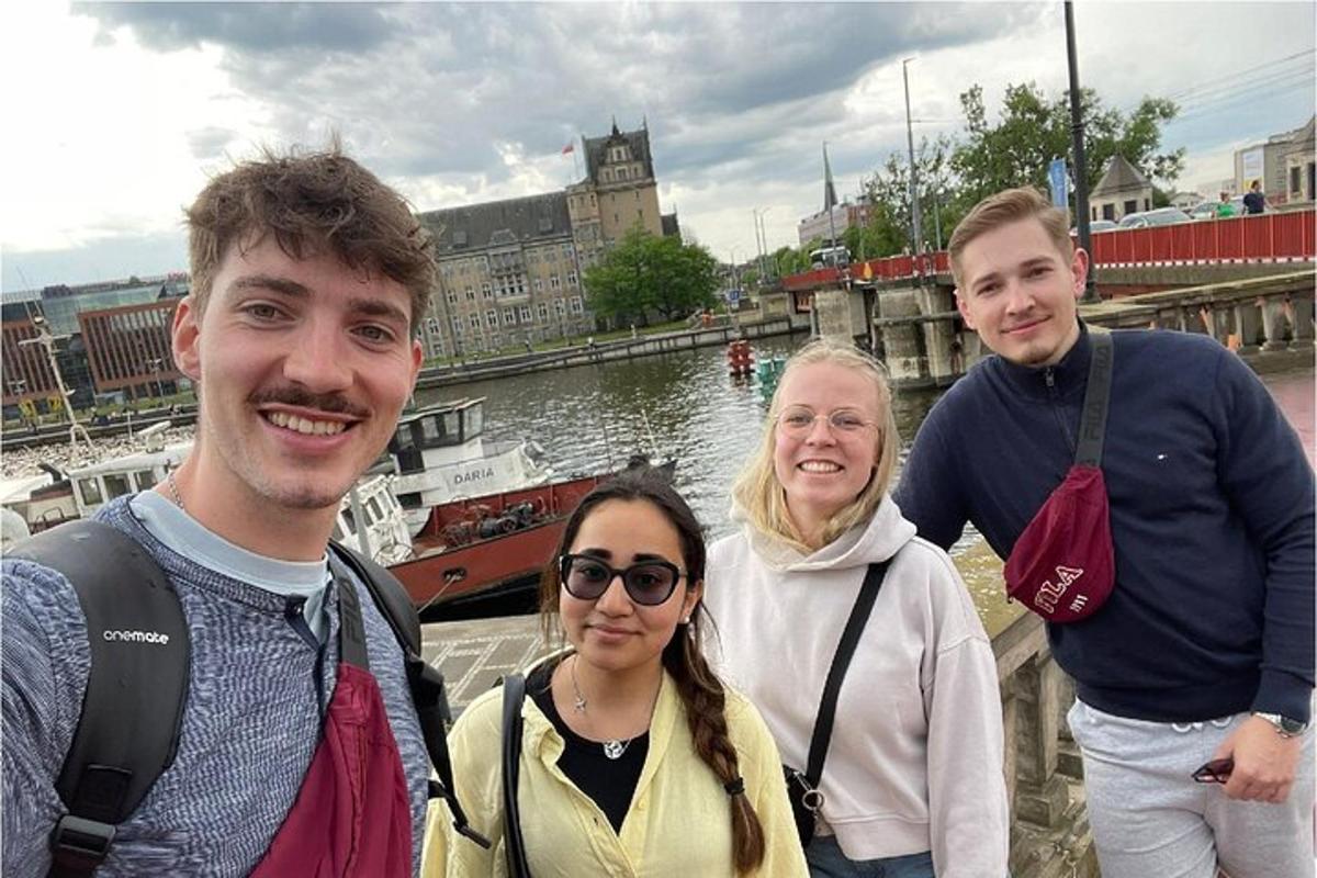 a group of people standing next to a river