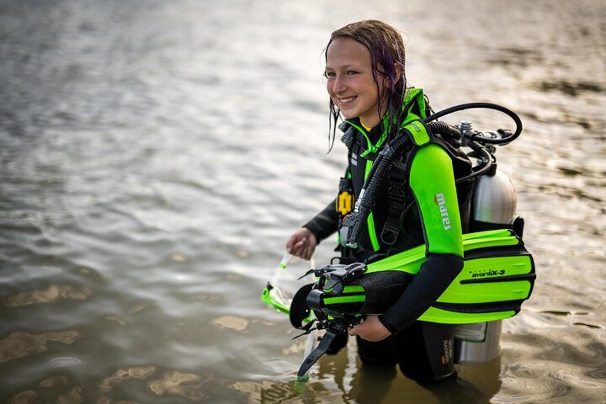 a woman wearing a life vest in the water