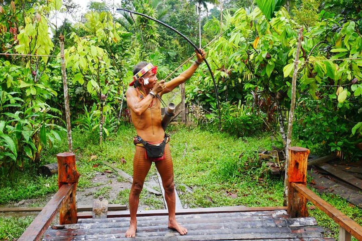 a woman in a bikini with a bow and arrow