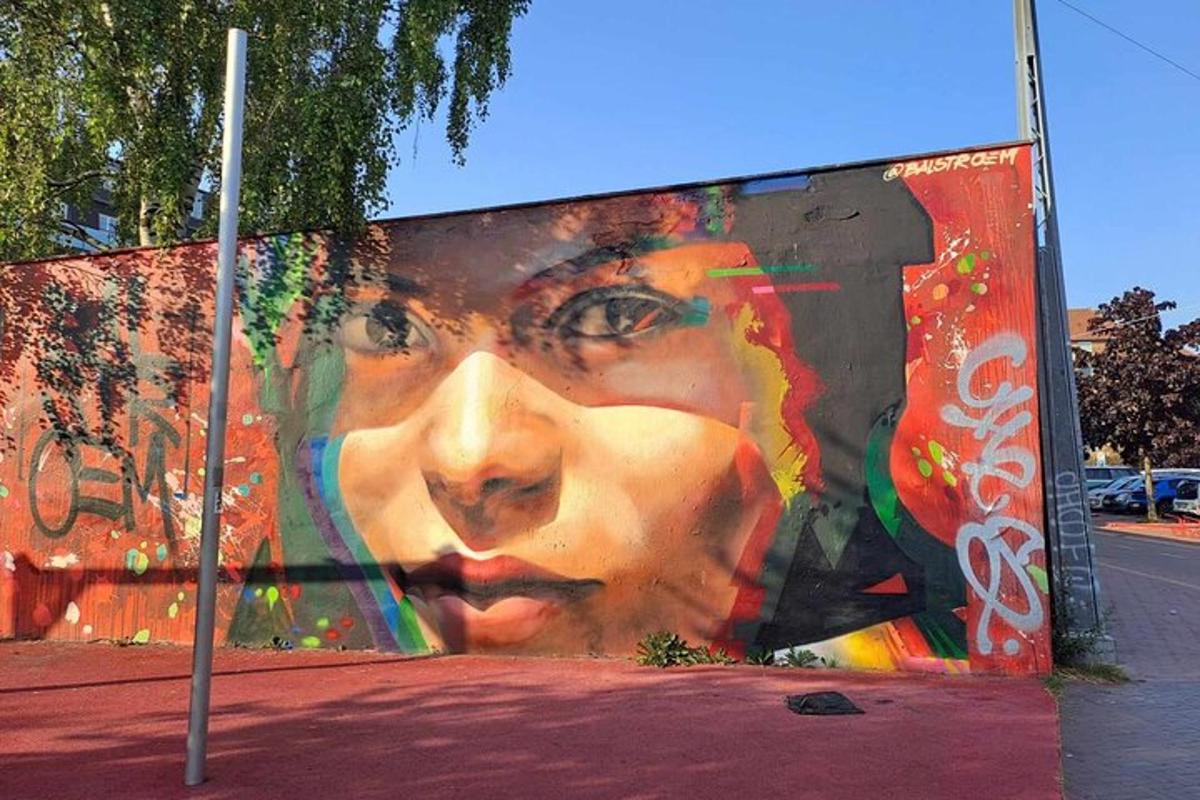 a large painting of a woman on the side of a building