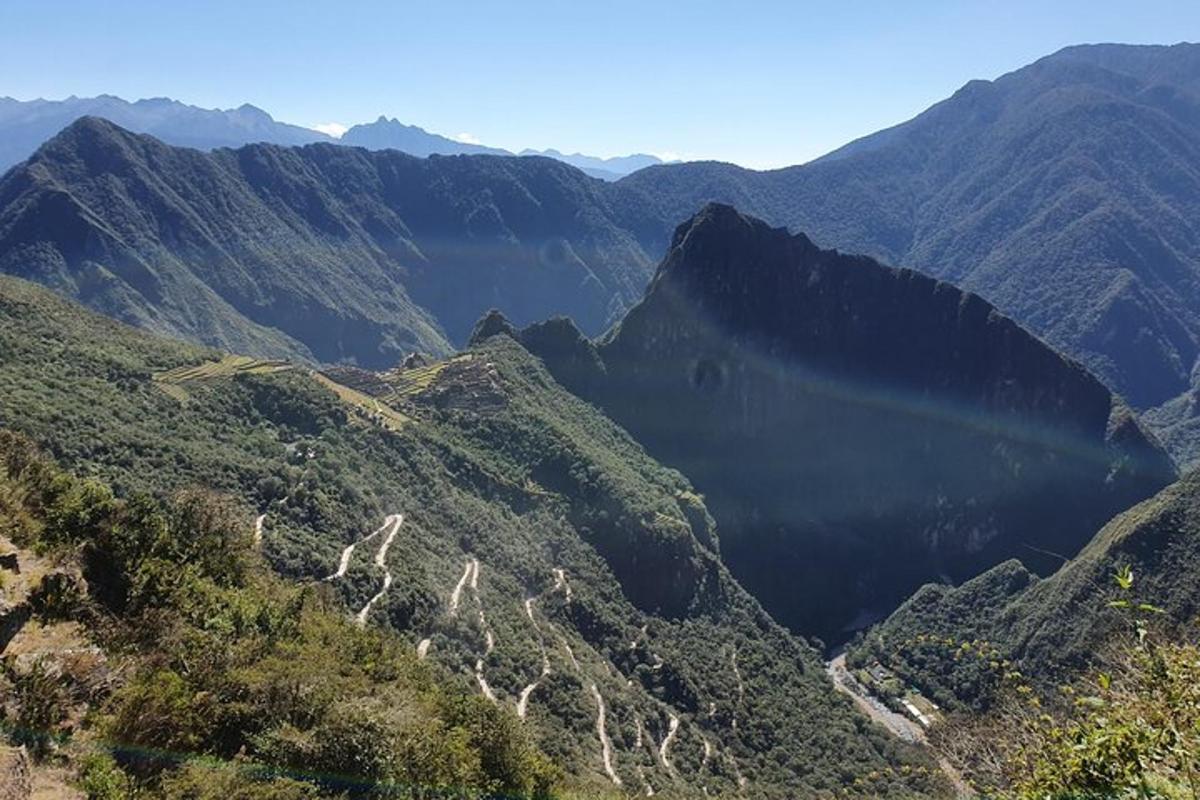 a view of a mountain valley with a road