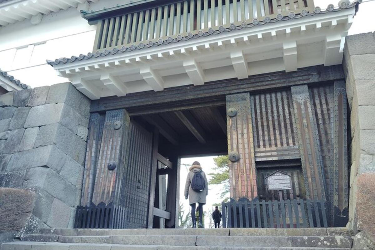 a person standing in the doorway of a building