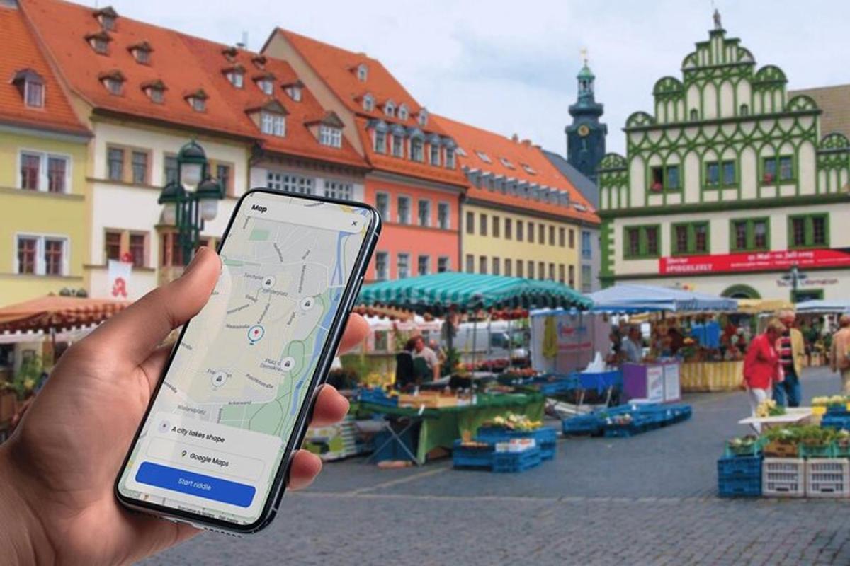 a person holding a cell phone in front of a market