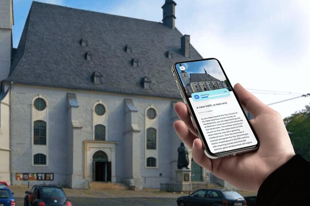 a person holding a cell phone in front of a building
