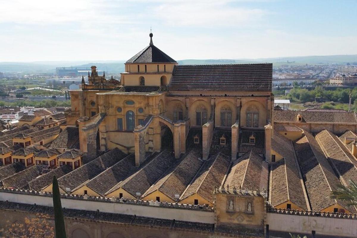 an old building with lots of roofs in a city