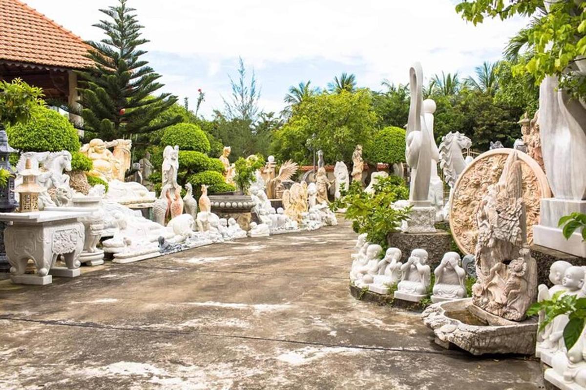 a garden filled with lots of white statues