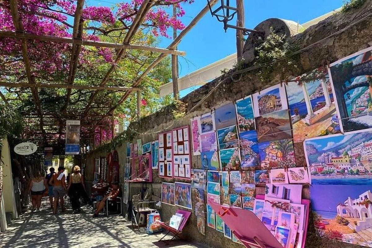 a wall with paintings and pictures on it