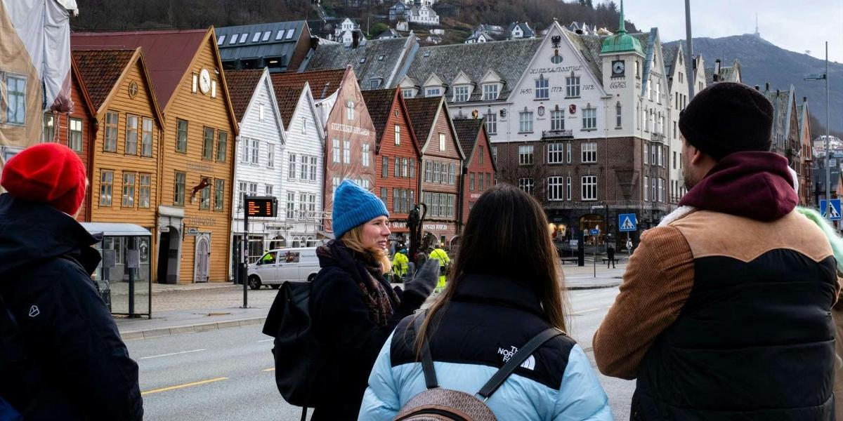 a group of women walking down a city street