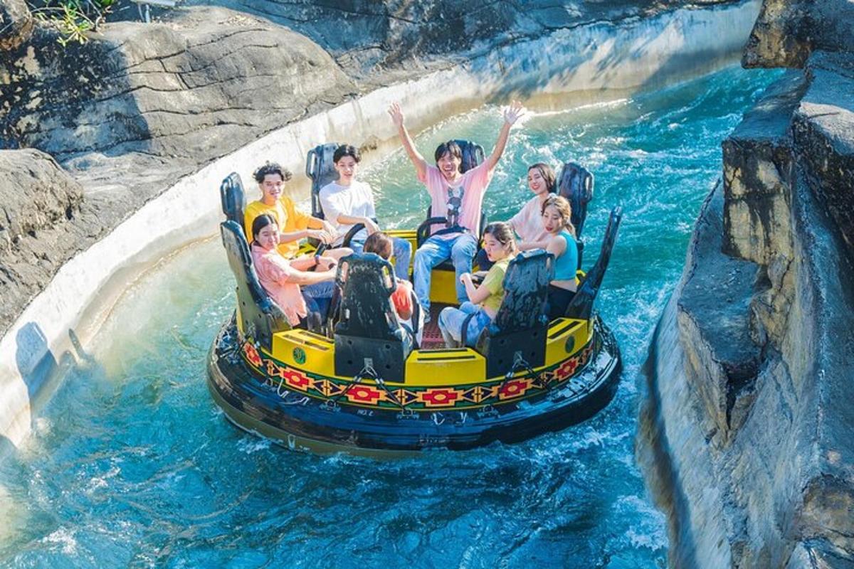 a group of people riding a roller coaster on a water slide