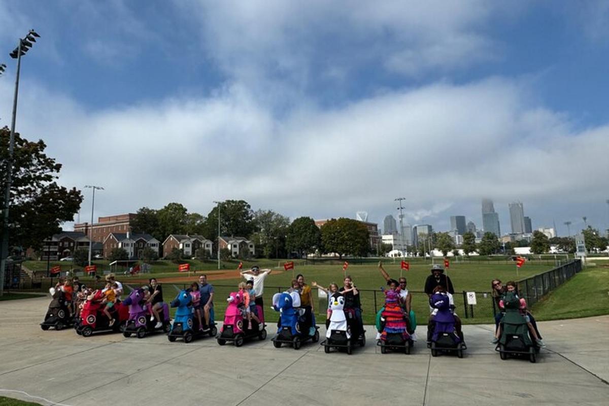 a group of people on scooters parked in a park
