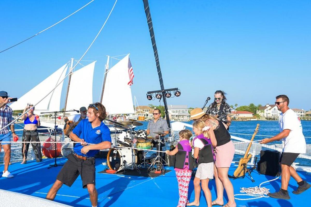 a group of people standing on a sail boat