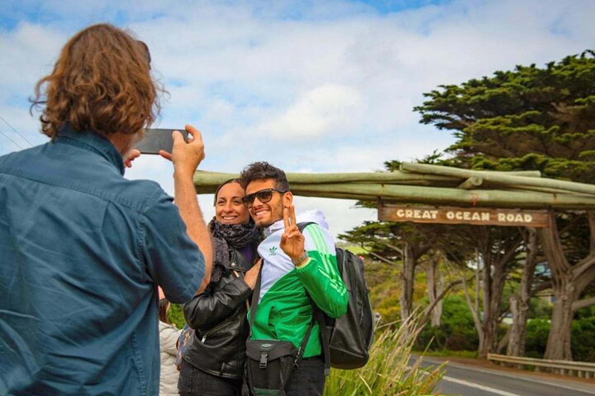 a woman taking a picture of two men taking a picture