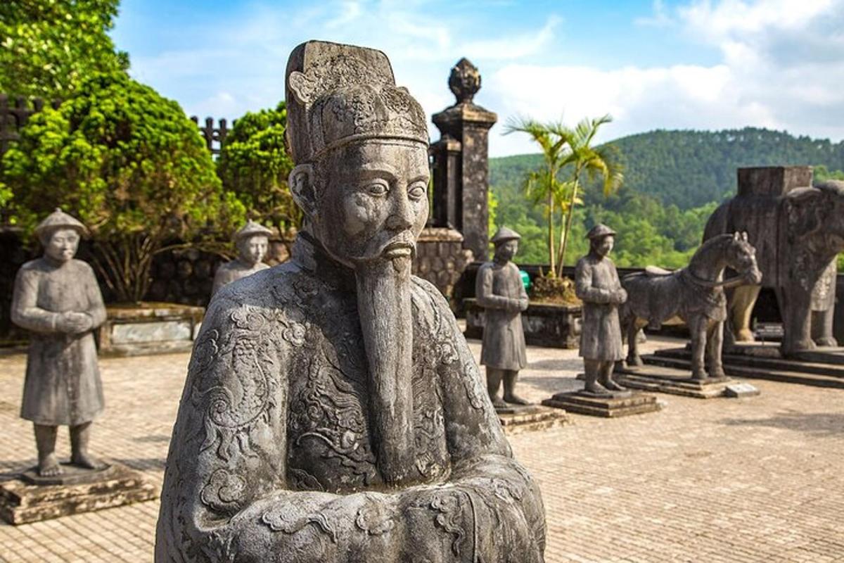 a statue of aitating person in a park