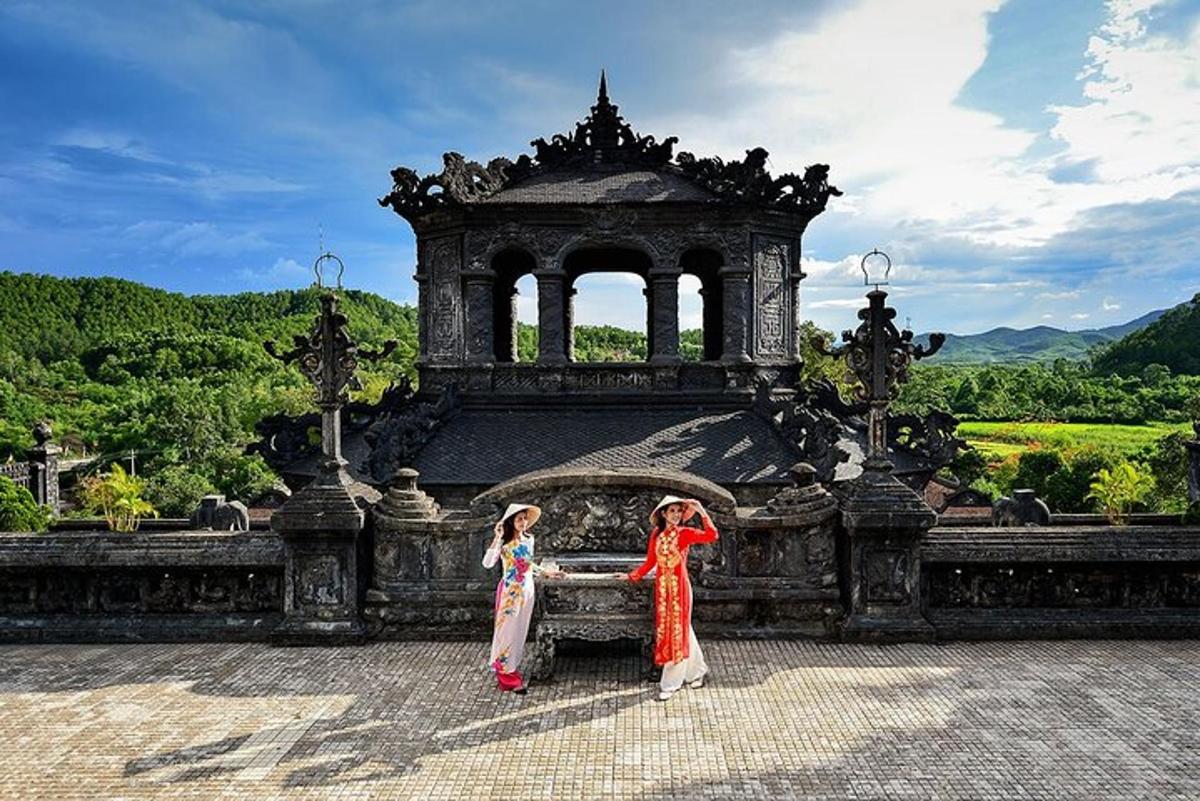 two girls are standing in front of a building