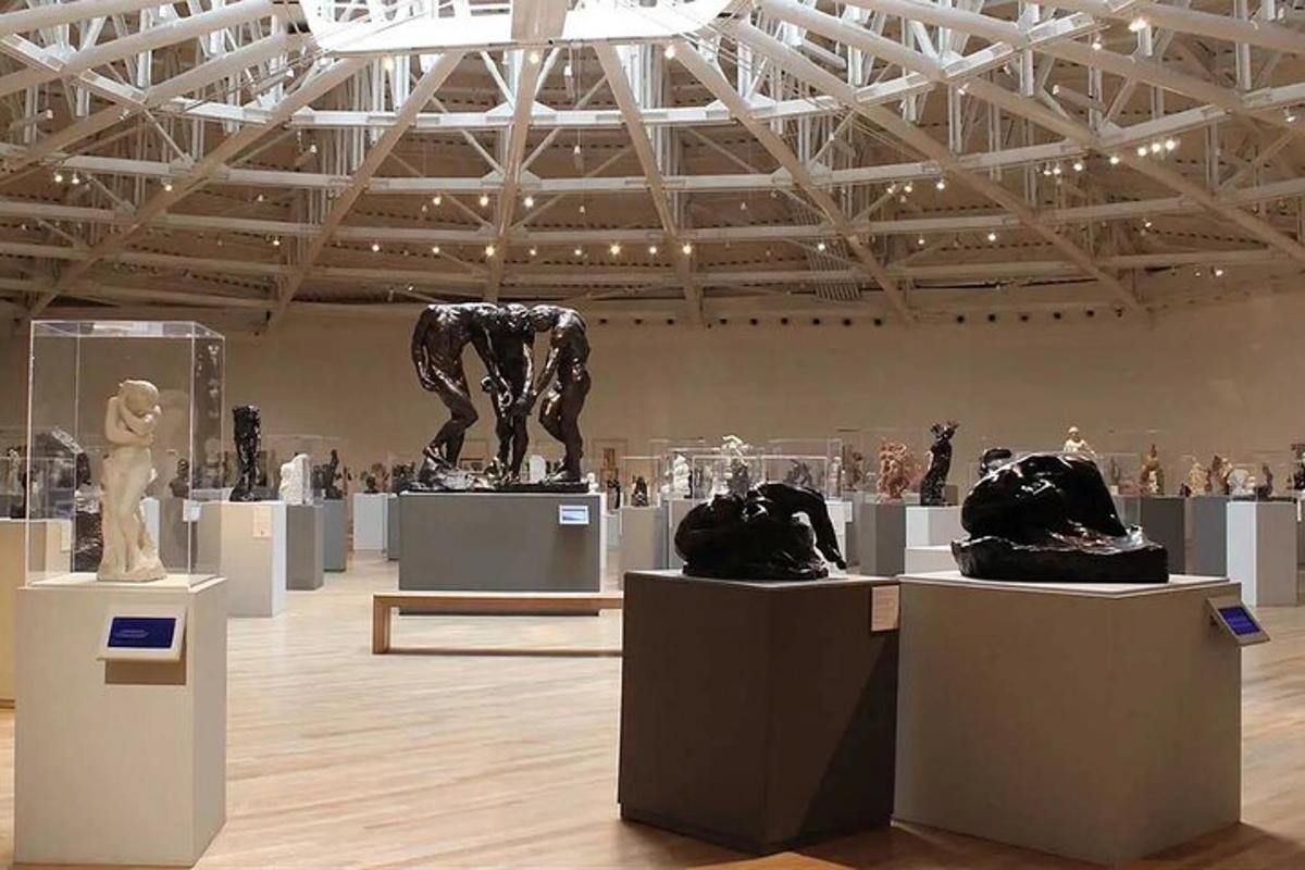 a museum with a bunch of statues on display