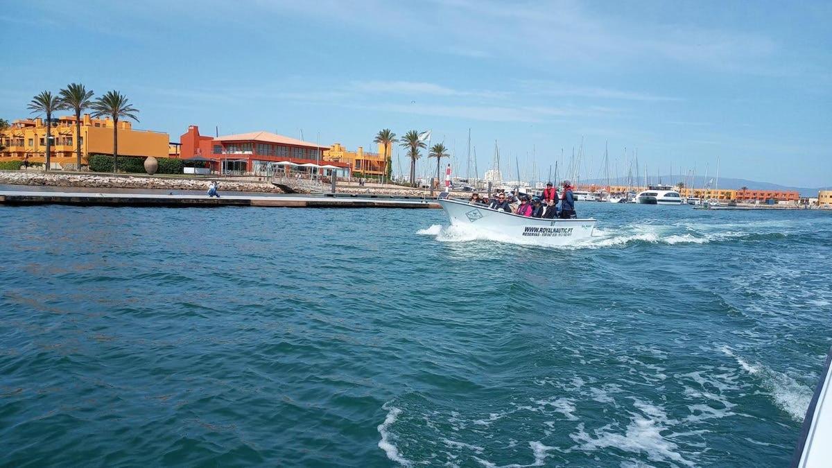 a group of people on a boat in the water
