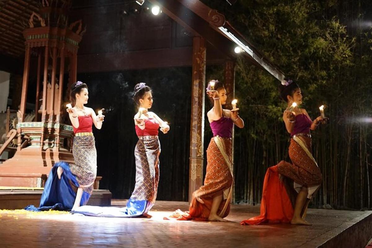a group of women on a stage holding candles