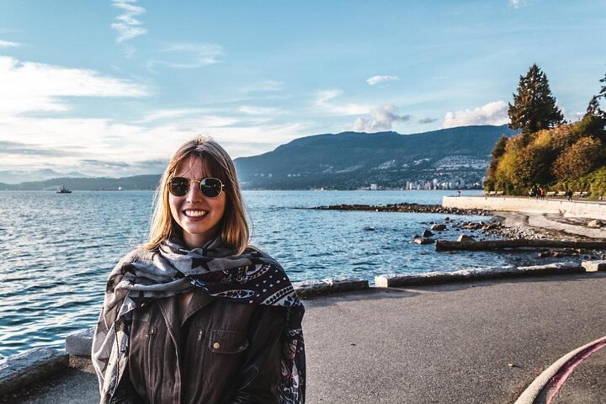 a woman standing next to a body of water