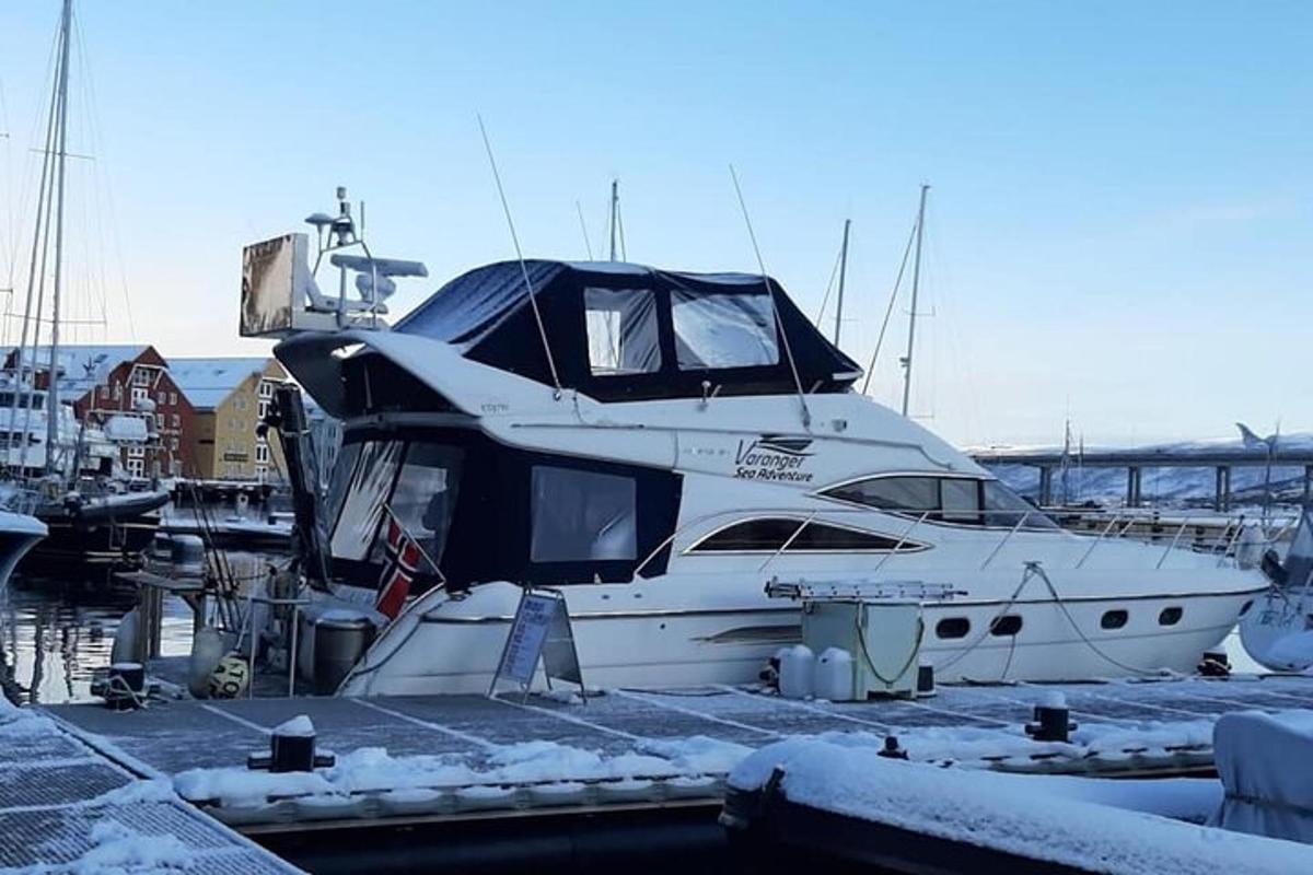 a boat is docked at a marina in the snow