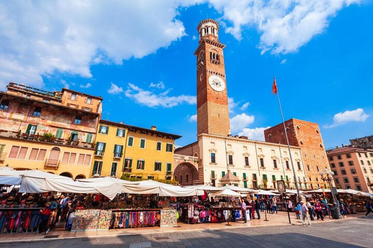 a clock tower in a city with a market