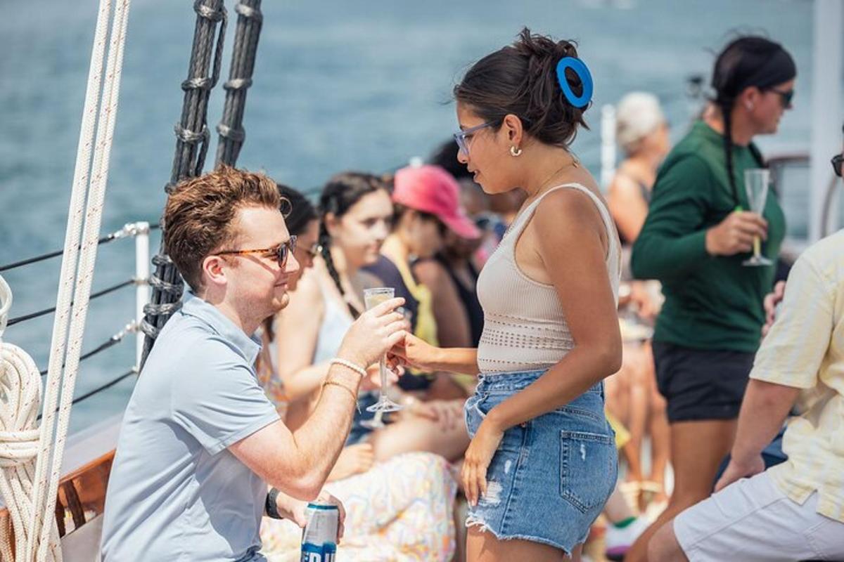 a man and a woman standing on a boat