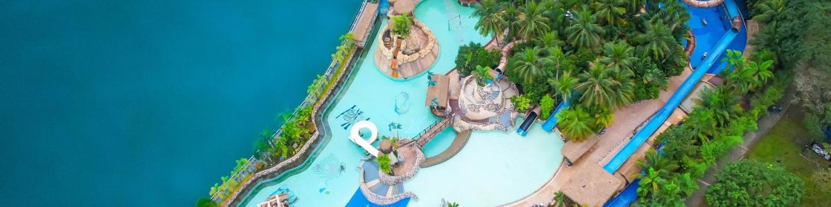 an overhead view of a water park with boats