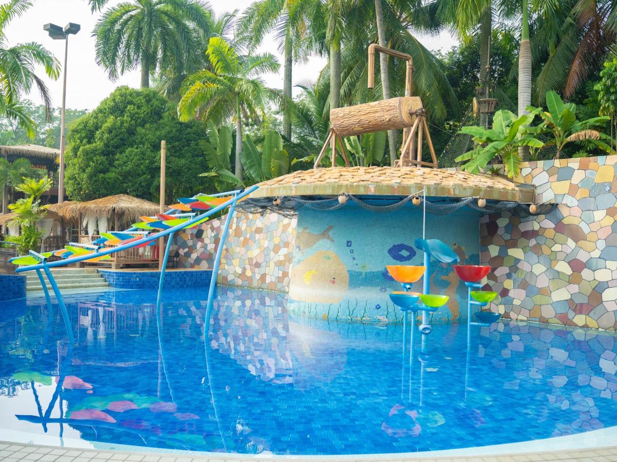 a swimming pool with chairs and cocktails in it