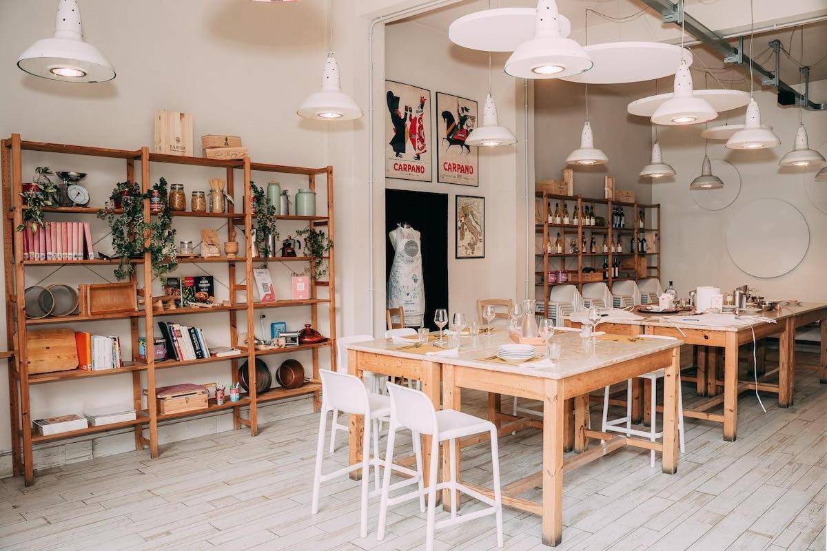a dining room with wooden tables and white chairs