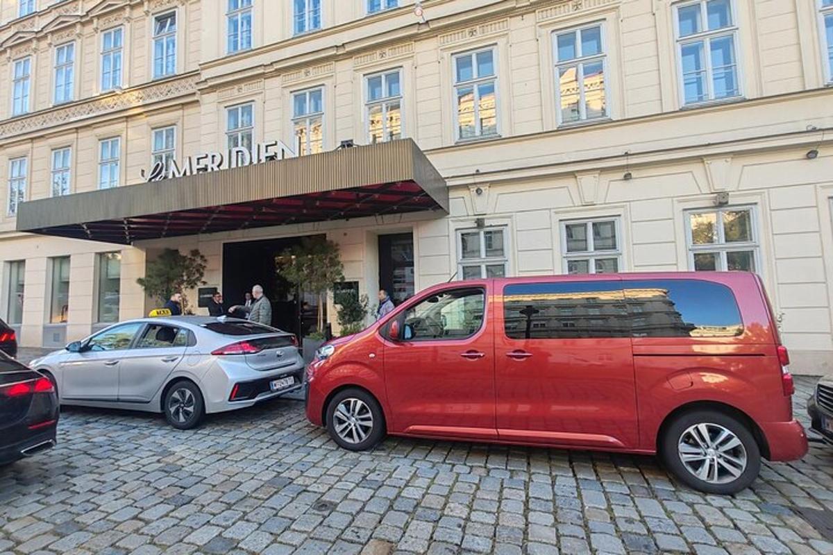 a red van parked in front of a building