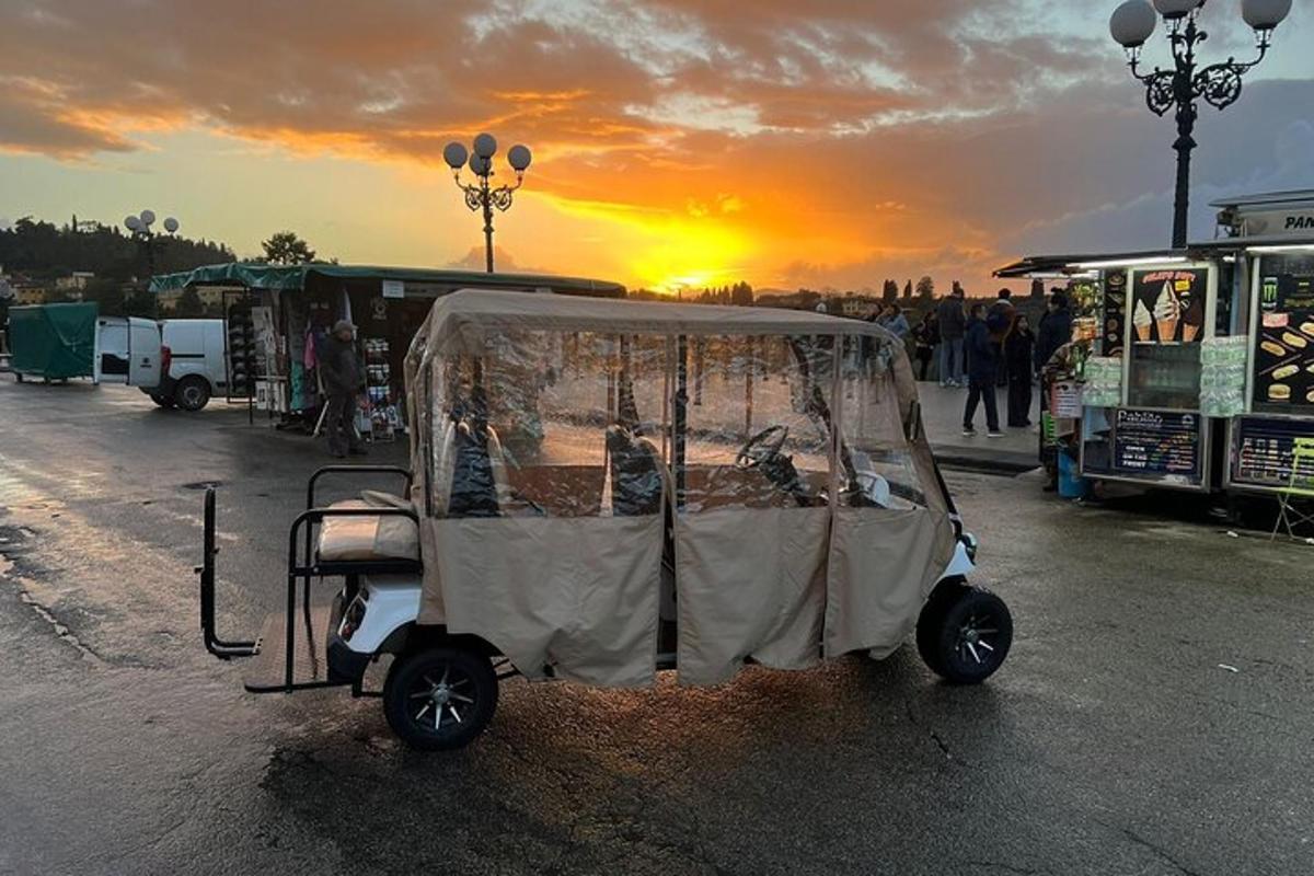 a small golf cart parked in a parking lot