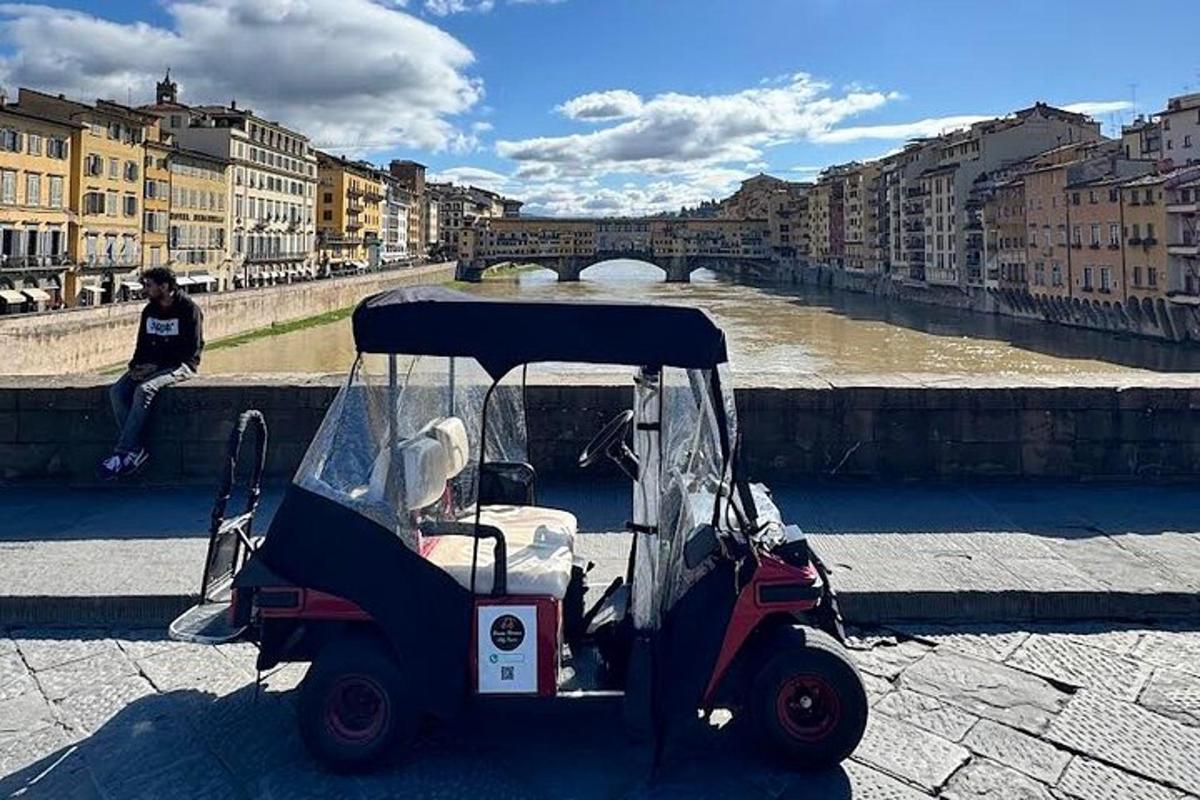 a golf cart parked next to a river